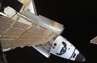 The Orbiter Endeavour viewed from the Mir Space Station during STS-89. A Mir solar array is in view. 